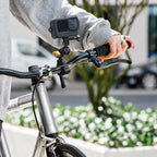 BARUNOR square scene 20261019: Square parked-bicycle installation scene; camera and bicycle not included