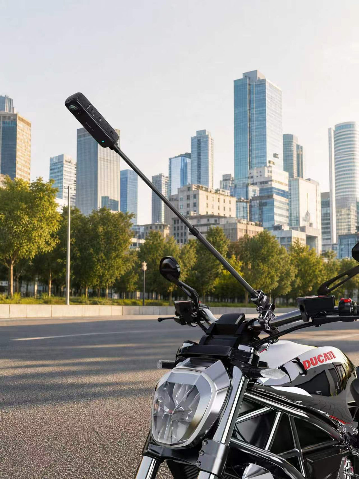 Side view of the FLW153 pole and separately sold clamp on a stationary motorcycle; camera, clamp and motorcycle not included