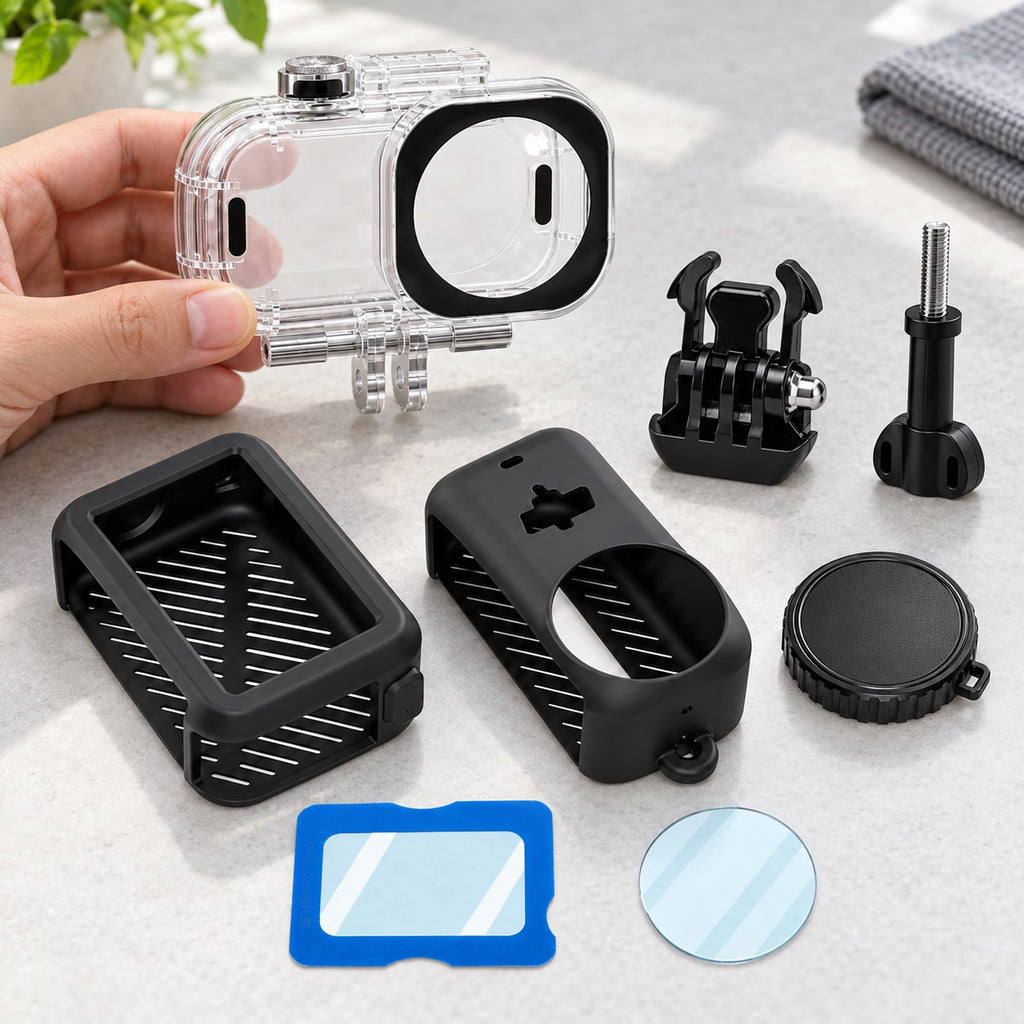 Nano protection accessory bundle prepared on a work surface; hand checking the empty clear housing before installation, with silicone covers, lens cap, protectors, mounting base and screw kept separate