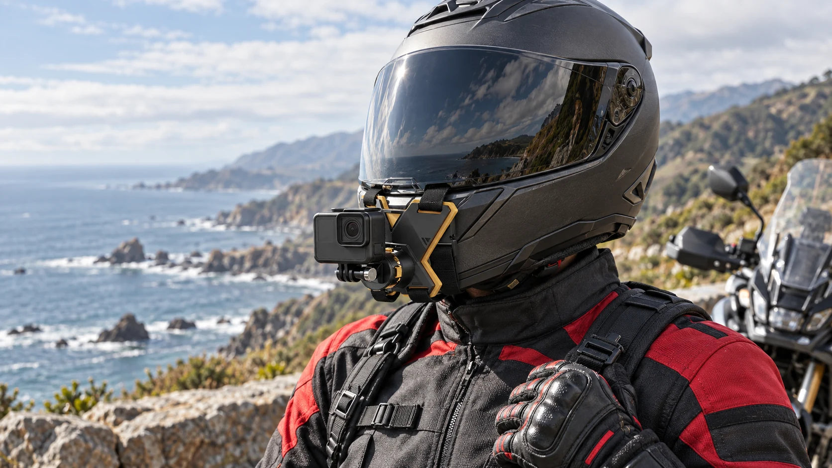Illustrative scene of a helmet chin camera mount with a parked motorcycle at a coastal overlook